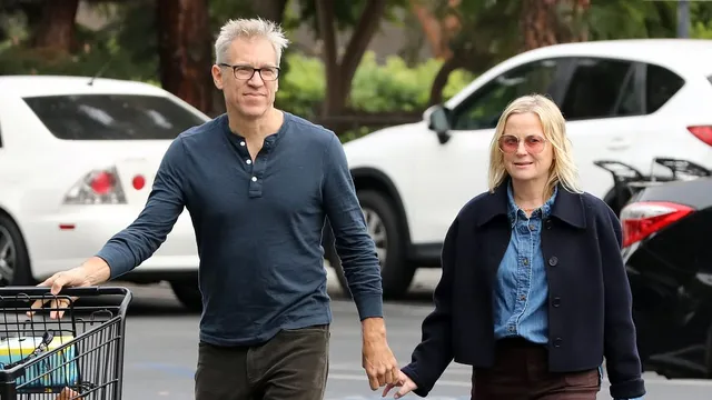 Amy Poehler is in a relationship with Joel Lovell