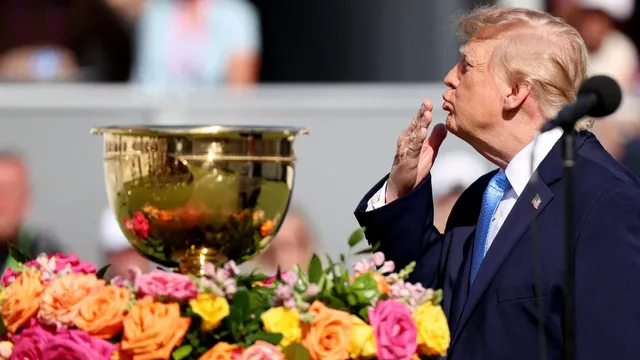 US President Donald Trump and Australian golfer Adam Scott share prolonged handshake at Presidents Cup