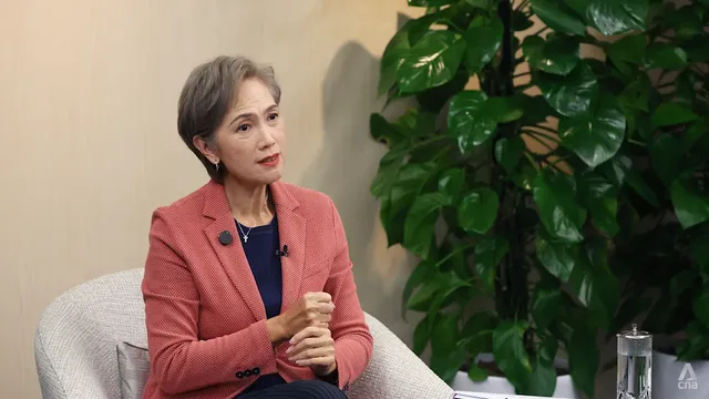 Singapore's Minister Josephine Teo says AI company safeguards are insufficient and urges multi-layered defenses