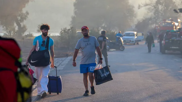 Two dead as wildfires force evacuations on Greek island