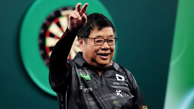 Paul Lim continues to defy age as oldest winner at World Darts Championship