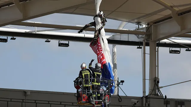 Parachutist rescued after crashing onto rugby stadium roof