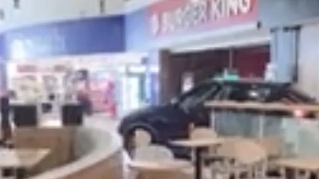 Masked thieves ram raid service station and escape with cash machine
