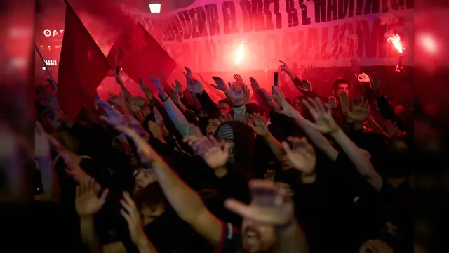 Police in Barcelona arrest 100 after hooded protesters loot shops and set fires