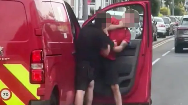Postman attacked in road rage incident on city street