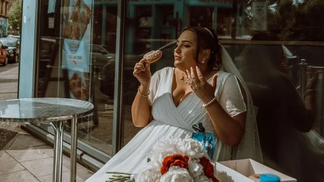 and tucks into doughnut to toast nuptials