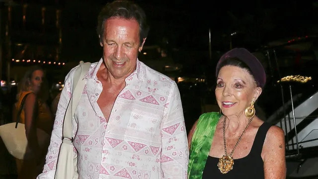 Joan Collins dazzles during romantic yacht dinner