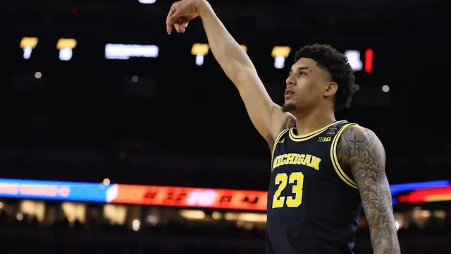 Michigan overwhelms Arizona to secure a spot in the national title game