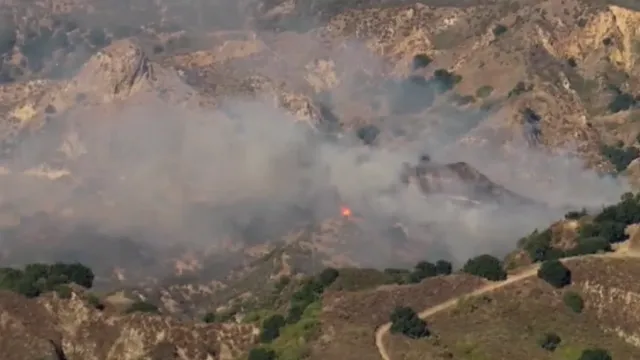 Firefighters battle brush fire in Santa Clarita, evacuation orders issued
