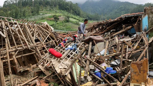 Landslide kills eight and leaves dozens missing in Indonesia