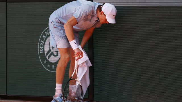 Jannik Sinner collapses in French Open defeat after heat struggle