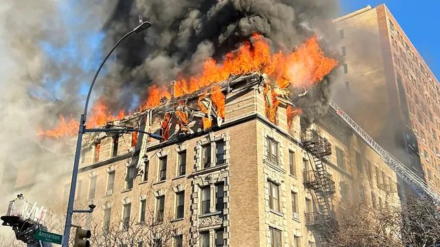 Fire engulfs Upper West Side building, showering debris onto busy sidewalk