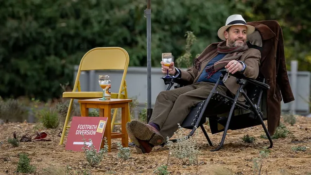 Man protests against wasteful council spending by lounging on roundabout