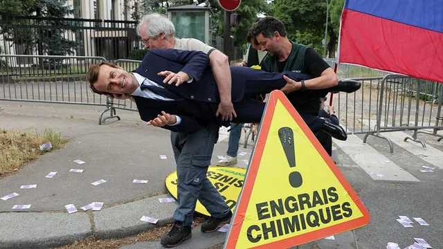 Greenpeace activists steal Macron wax figure amid protest against Russian contracts